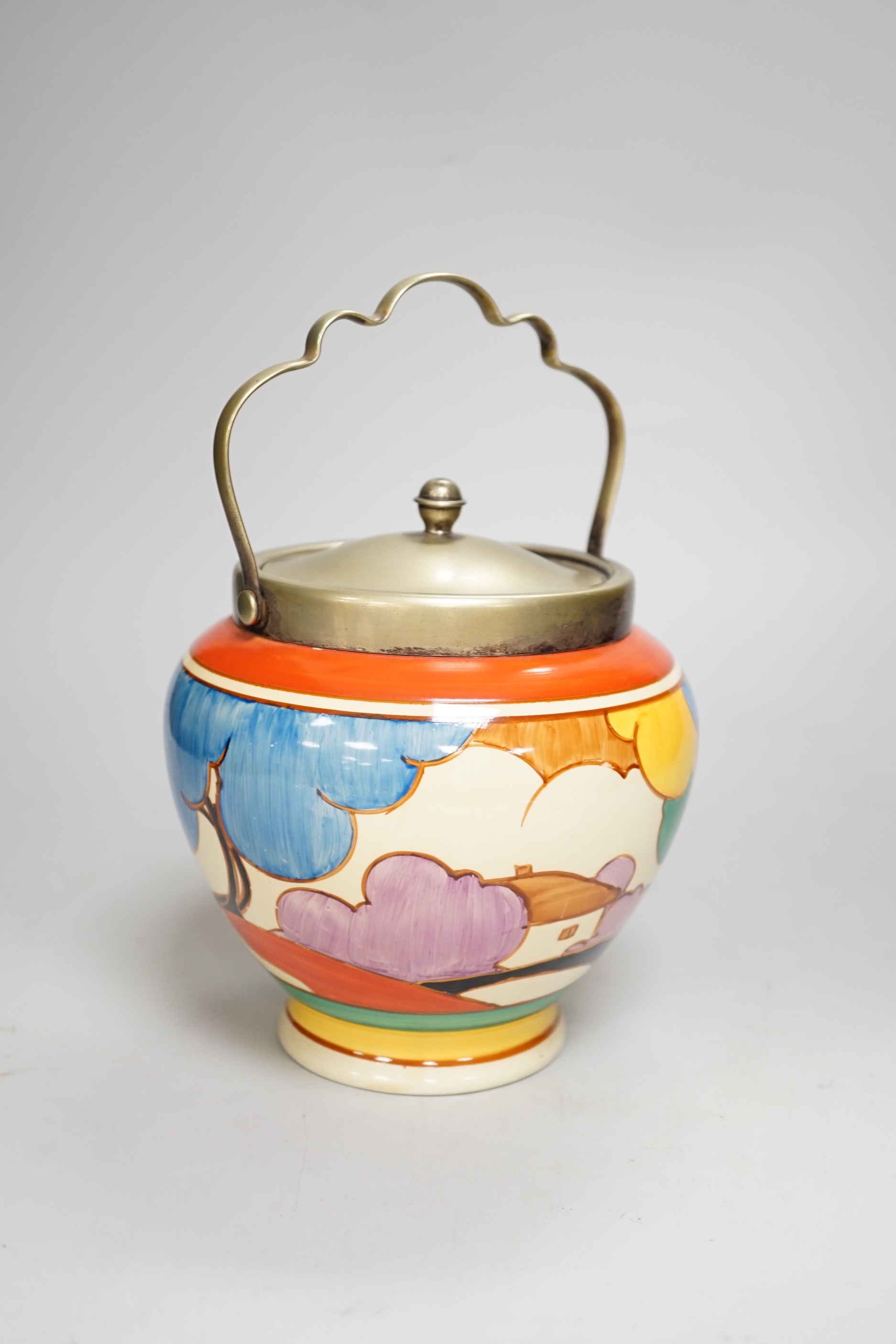 A Clarice Cliff biscuit jar, Blue Autumn, c.1931 with silver plated lid and swing handle, 21cm high